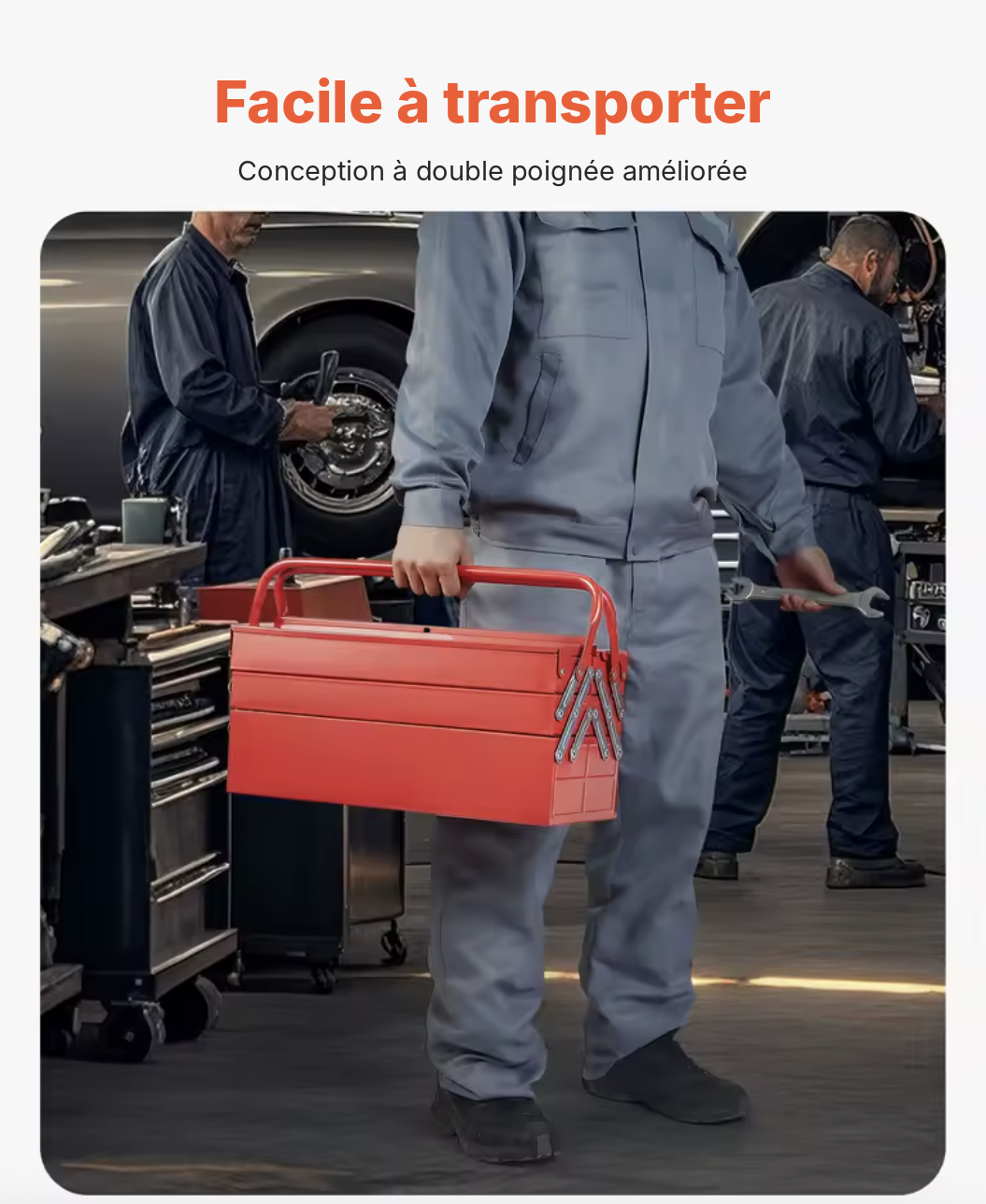 Caisse à outils métallique portée par la double poignée dans un atelier